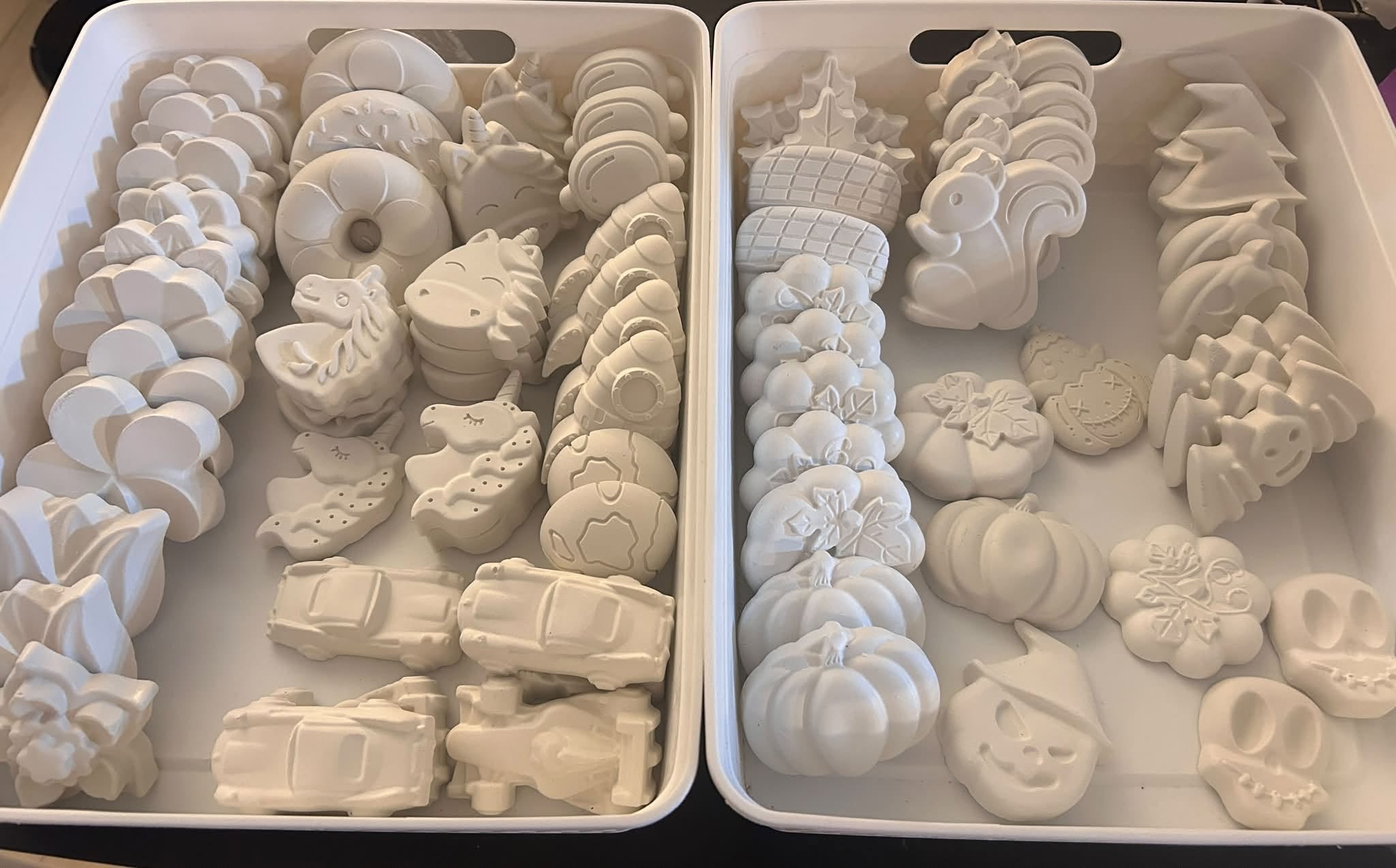 Trays filled with handmade plaster pieces ready to be packed
